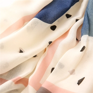 Close-up of soft lightweight fabric texture with heart prints and striped patterns