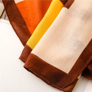 Detailed close-up of geometric color block cotton linen scarf showing fabric texture