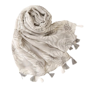 Écharpe élégante et légère aspect lin avec motifs floraux et bords à franges