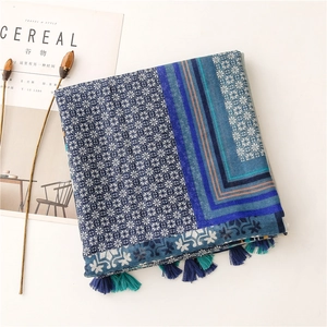 Detail of navy and sky blue geometric pattern scarf with stylish fringe edges