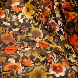 Detailed macro view of retro floral print on lightweight semi-transparent cotton scarf