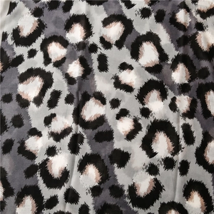 Macro detail of breathable cotton-linen scarf showing stylish leopard print pattern