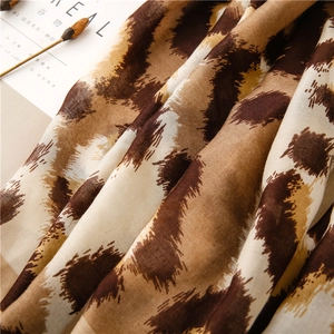 Close-up of leopard print cotton linen scarf with breathable texture and soft fiber details
