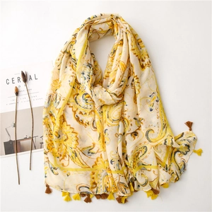 Bohemian paisley print cotton linen scarf in yellow with fringe tassels on white background