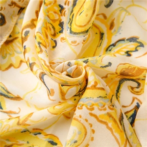 Macro view of paisley print on cotton linen scarf with soft woven fabric texture