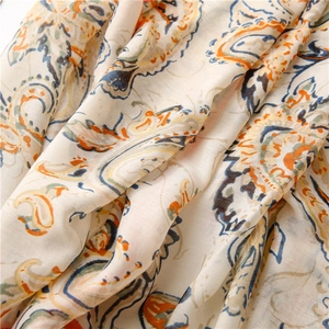 Macro shot of boho paisley print fabric with soft pleats and fine cotton-linen texture