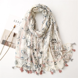 Detailed shot of paisley print cotton linen scarf with soft pink and grey tassel edges