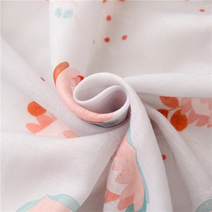 Detailed macro view of lightweight floral cotton linen fabric with soft draped texture