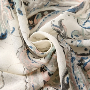 Detail shot of lightweight paisley print fabric with soft folds and elegant textures