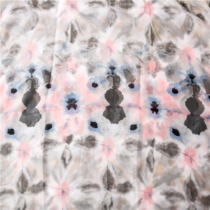 Detailed macro shot of the abstract floral pattern and ink dye texture on long scarf