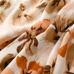 Detail of floral paisley print on lightweight cotton-linen fabric scarf with soft texture