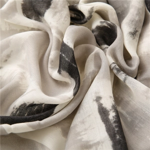 Macro detail of abstract ink print on soft lightweight linen-silk scarf fabric