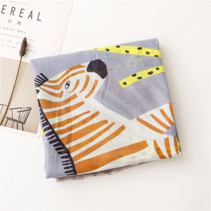 Detail of artistic zebra print scarf with leopard accents on lightweight cotton linen fabric