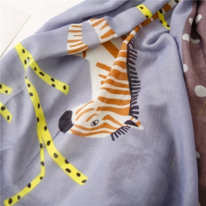 Macro shot showing zebra pattern texture and soft fabric detail of the cotton linen scarf