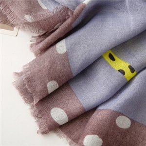 Detail of soft lavender wool scarf showing textured fringe edges and zebra print patterns