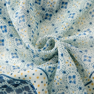 Close-up of geometric floral pattern and texture on a soft linen feel scarf shawl