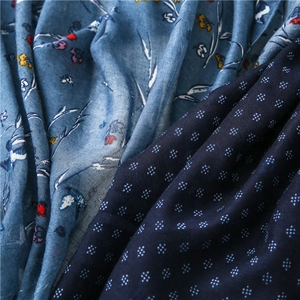 Detail of floral and geometric patterns on vintage cotton linen scarf fabric texture