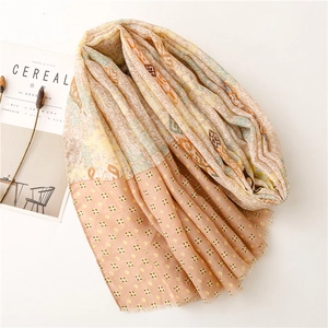 Detail of soft cotton-linen scarf featuring ethnic paisley pattern and fringed edges