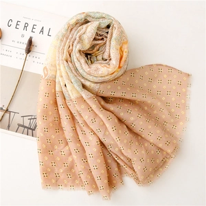 Detail of soft cotton linen shawl with paisley patterns and delicate fringed edges