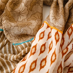 Detail of vintage geometric floral print scarf in breathable cotton linen blend fabric