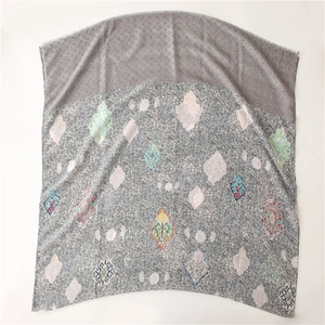 Detail of soft cotton-linen scarf featuring ethnic geometric patterns and fringe edges