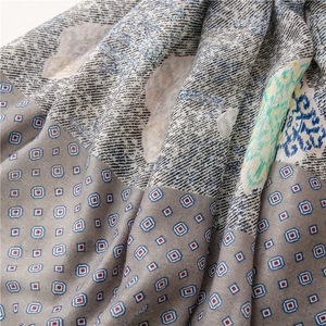 Detailed close-up of paisley pattern and soft cotton linen texture of the women shawl