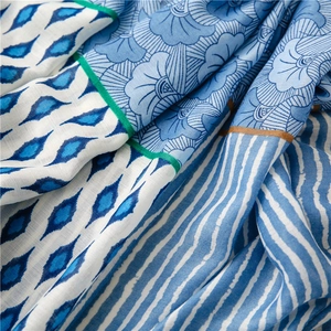 Macro view of geometric floral print on soft cotton-linen feel scarf fabric details