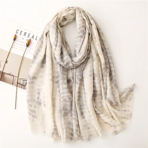 Artistic cream cotton-linen scarf with grey tie-dye dots and frayed edges layout