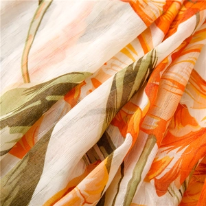 Detail of vibrant yellow floral print on breathable textured cotton linen fabric scarf
