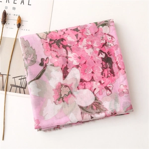 Detail of pink floral print scarf with soft texture and artistic lifestyle props