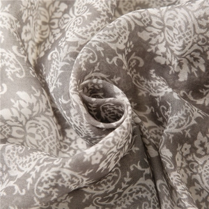 Macro view of paisley floral print on soft cotton-linen texture fabric scarf