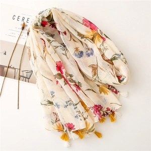 Retro floral scarf with sequins and tassels on beige fabric for sun protection