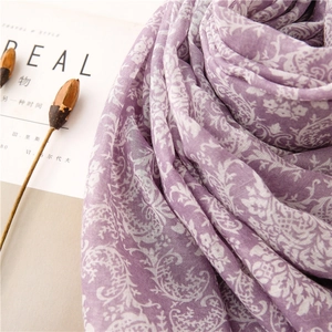Close-up of purple paisley floral scarf in breathable cotton-linen blend fabric