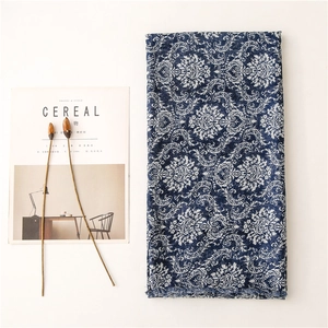 Detail of navy blue damascus scarf with cotton-linen texture and fringe edges