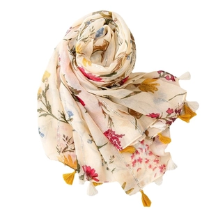 Vintage floral scarf with cream base, colorful print, sequins, and bicolor tassels