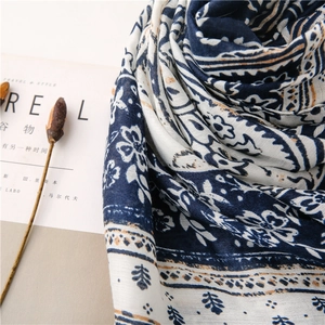 Detailed view of vintage blue floral printed long scarf with cotton linen texture fabric