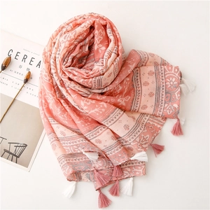 Pink and beige vintage floral print scarf with elegant tassels and ethnic style texture