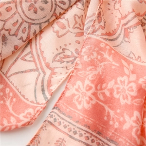 Close-up of vintage floral pattern on soft pink linen feel scarf with rolled edges
