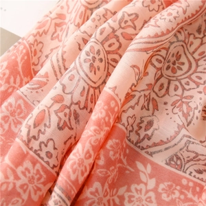 Macro shot of retro floral patterns on soft, breathable cotton-linen feel scarf
