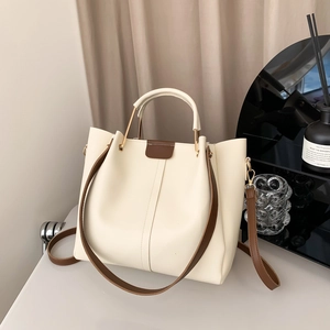 Retro cream faux leather tote bag with dark brown handles and adjustable shoulder strap