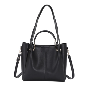 Retro black leather tote bag with gold hardware and dual handles for women commuting