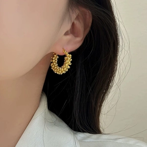 Elegant gold beaded hoop earrings featuring layered metallic texture for women's fashion