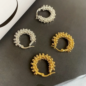 Minimalist beaded hoop earrings in gold and silver finish with textured ball design