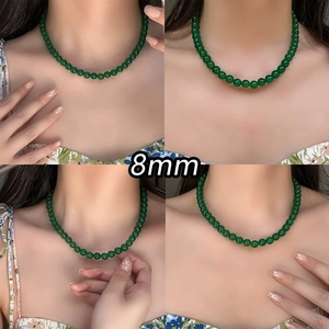 Close-up of elegant 8mm dark green chalcedony beaded necklace on a model's neck