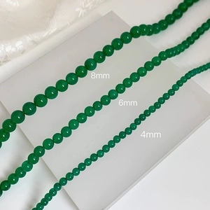 Detail of green chalcedony beaded necklace in 4mm, 6mm, and 8mm sizes for women