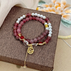 Elegant natural stone and pearl bracelet set with a gold Fu character pendant charm