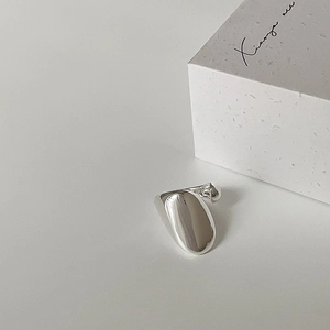 Minimalist silver organic irregular ring with polished finish and modern luxury style