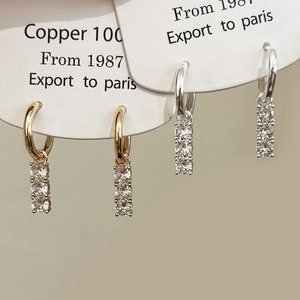 Elegant gold and silver copper hoop earrings with vertical triple zircon stone tassels
