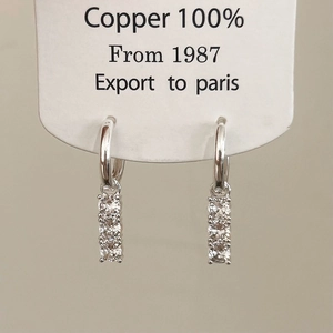 Minimalist silver copper earrings featuring four vertical zircon stones for daily wear