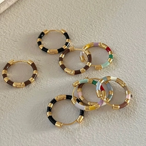 Detail of retro French enamel hoop earrings with color-block plating and clasp closure